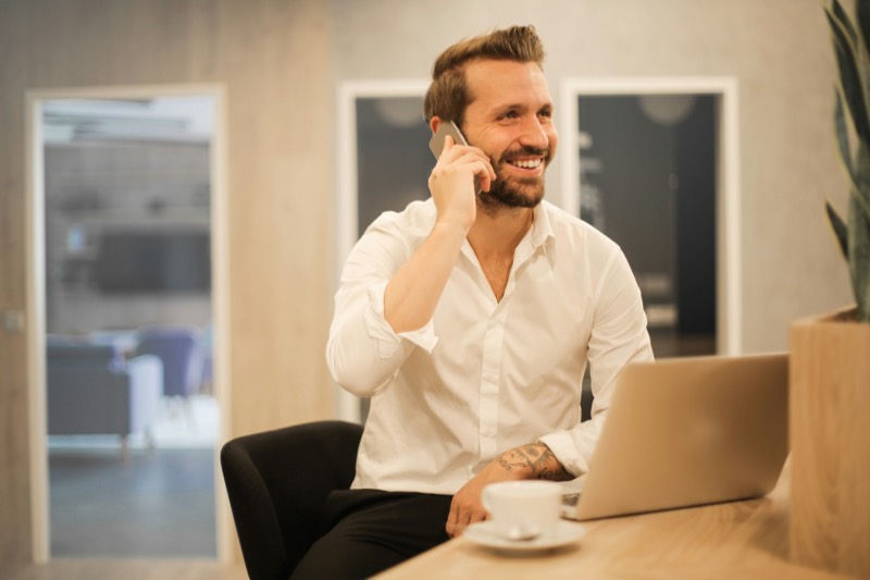Man at desk taking a call